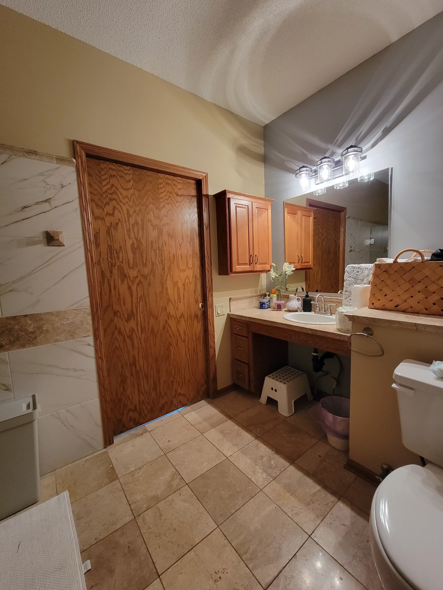 Well-appointed bathroom with grab bars and safety rails